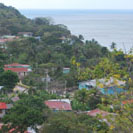 The road through Lazy Hill. Following the resettlement of Providence by white Jamaicans and their slaves in about 1788, the villages of Town, Free Town, Lazy Hill, Southwest Bay, Bottom House, Smoothwater Bay and Rocky Point each developed a distinct identity based on the families that built them. 